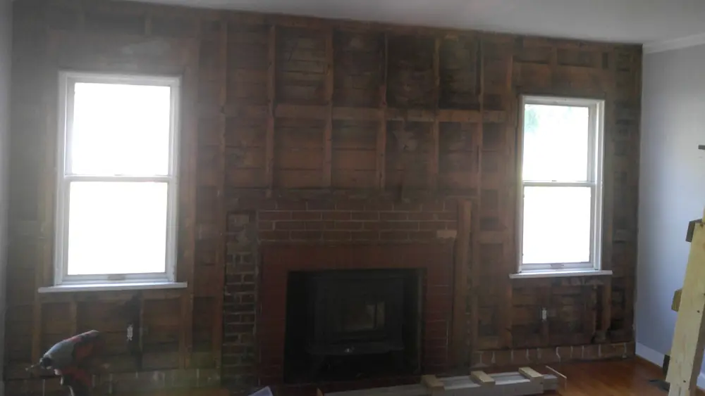 Fireplace wall opened to framing and sheathing