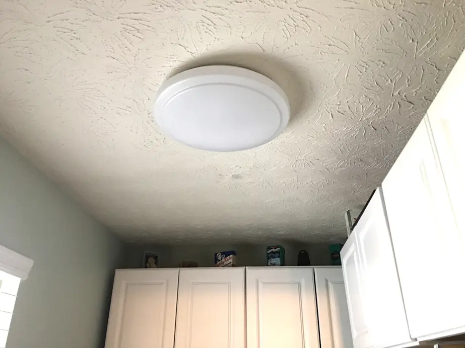 Laundry room John updated, with a new flush LED fixture over the wall cabinets